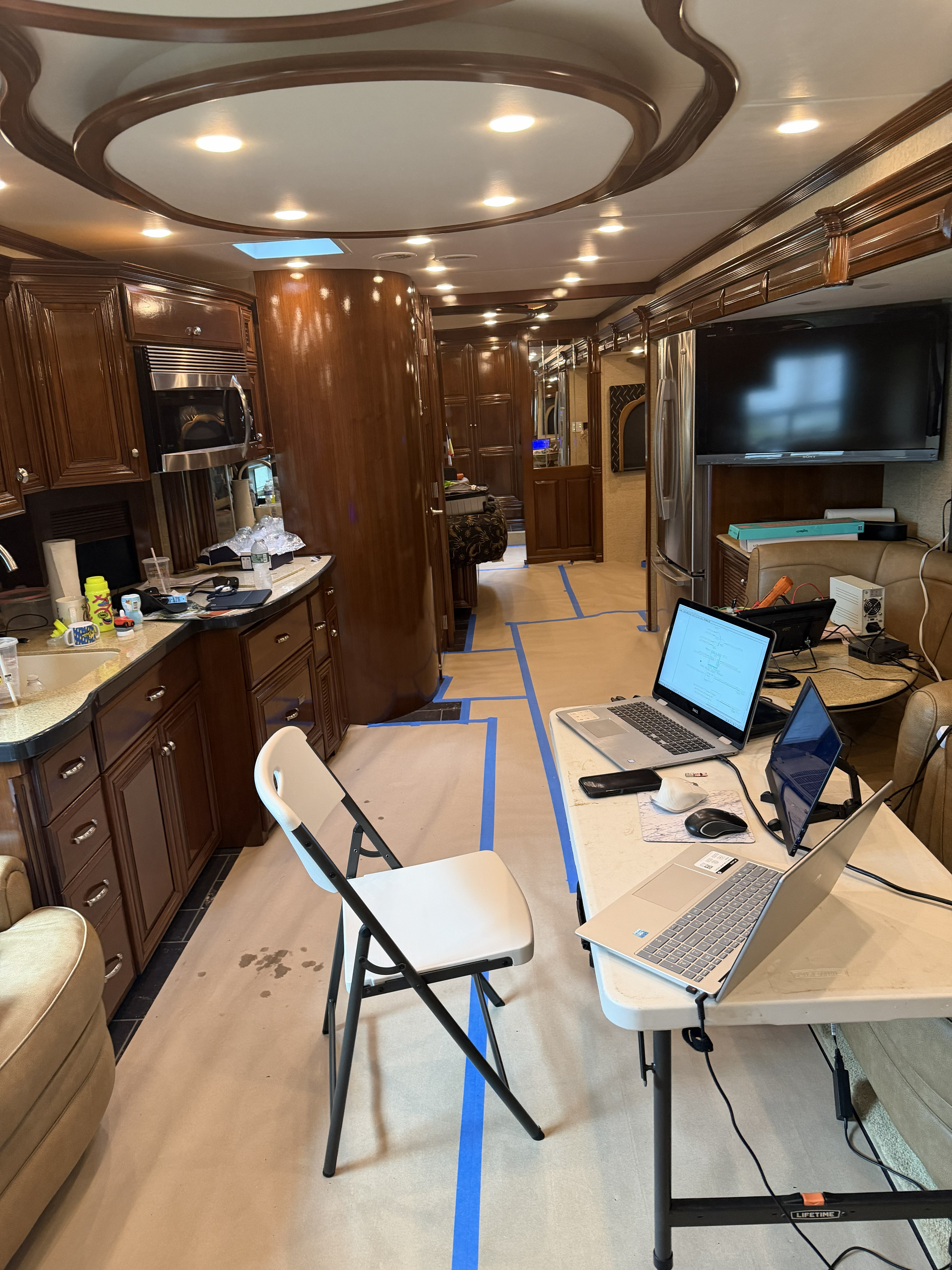 Protected mobile workbench set up cleanly inside a vehicle interior.
